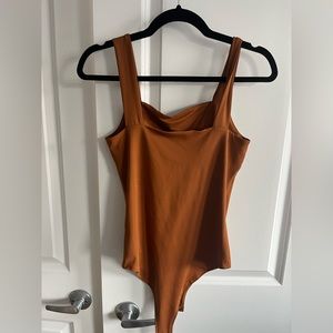 Burnt orange body suit